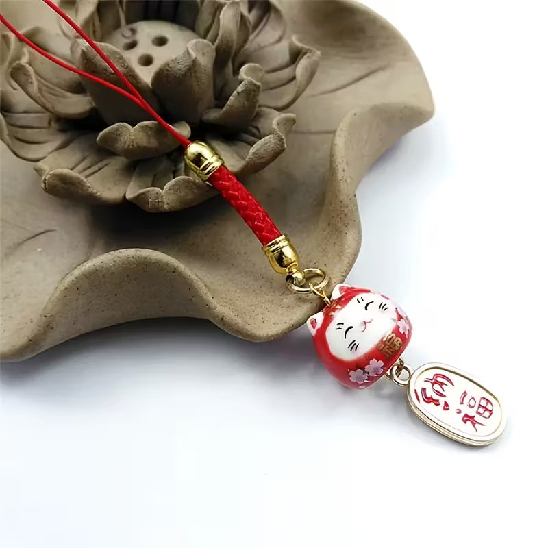 Colgante Maneki-neko de porcelana