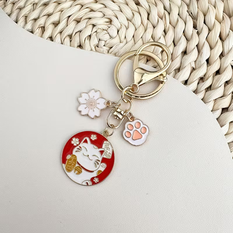 Llavero de la suerte. Flor y gato