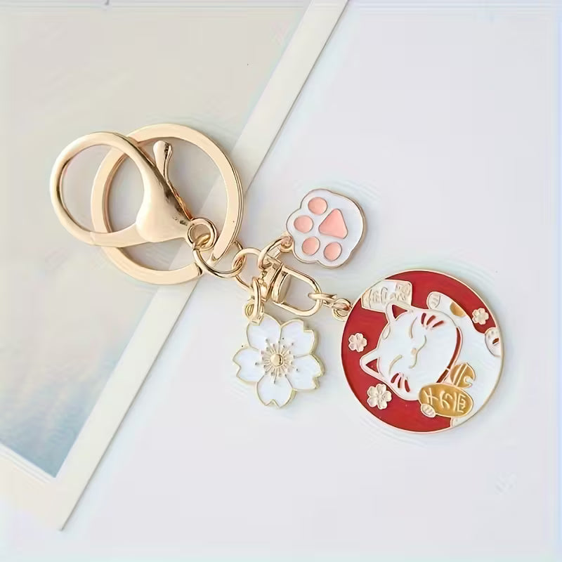 Llavero de la suerte. Flor y gato